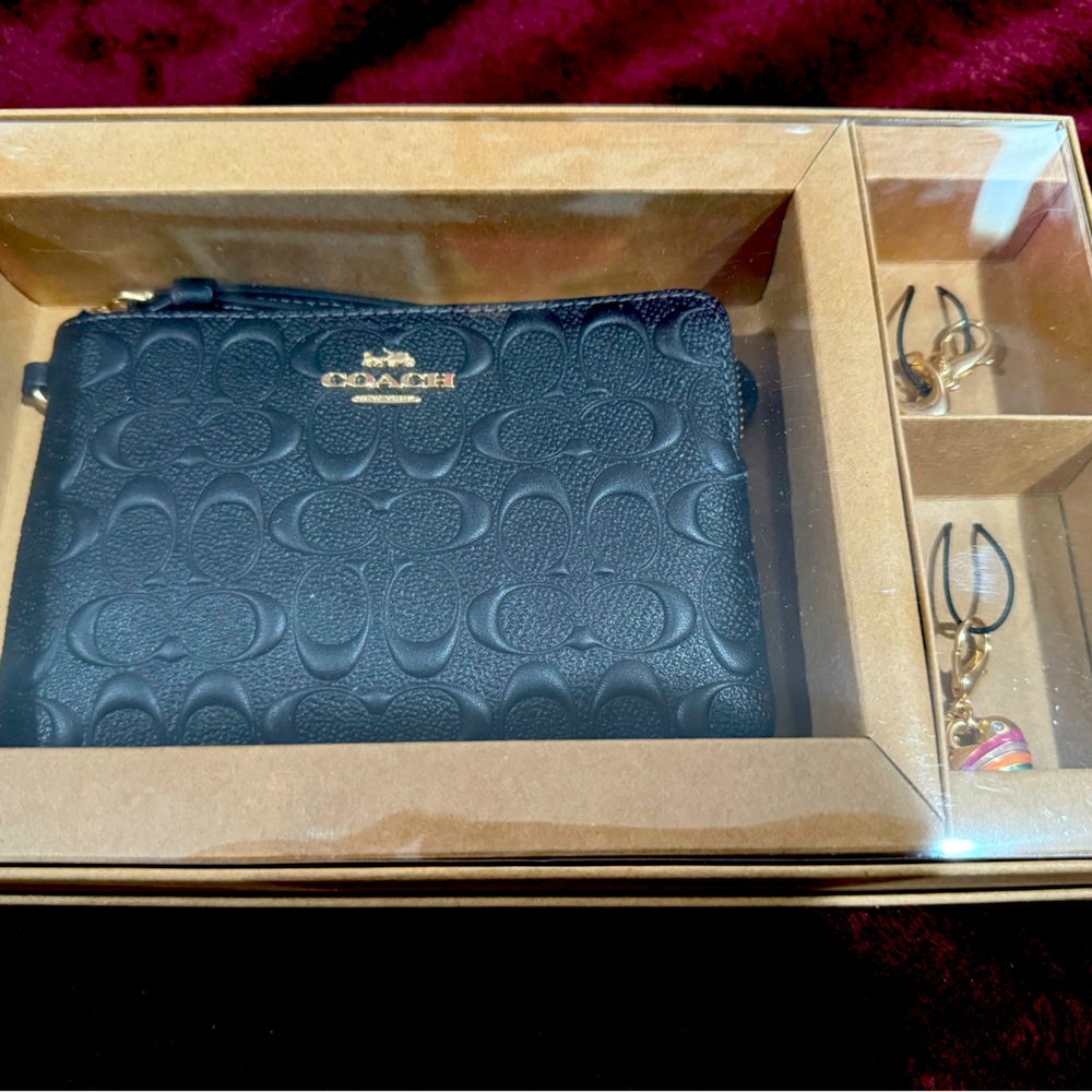 Brand new black leather coach wristlet with charms
